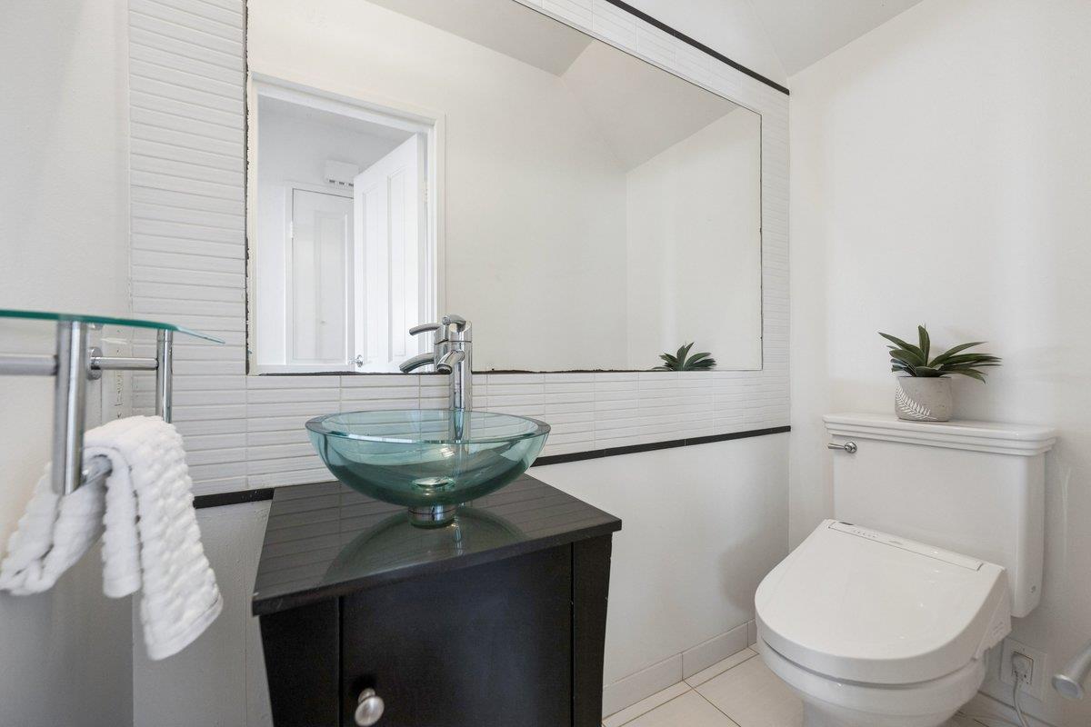 170 Beachview Avenue Pacifica, CA 94044 - Photo 69 of 85 a bathroom with a toilet a sink and mirror