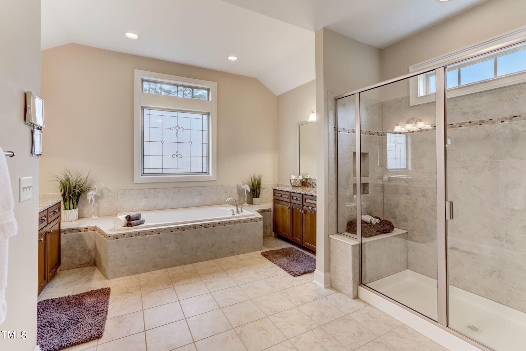 12901 Baybriar Drive Raleigh, NC 27613 - Photo 25 of 41 a spacious bathroom with a tub shower and sink
