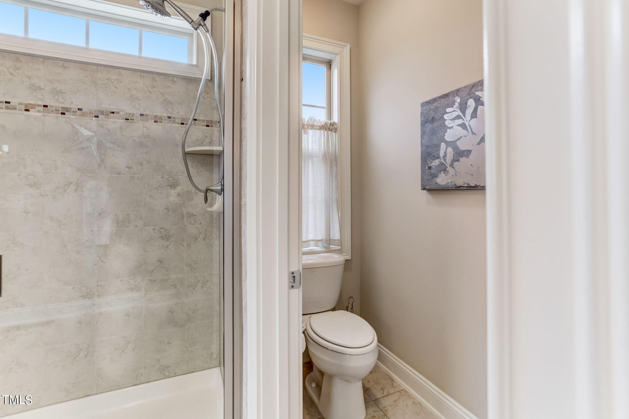 12901 Baybriar Drive Raleigh, NC 27613 - Photo 28 of 41 a bathroom with a toilet and a shower
