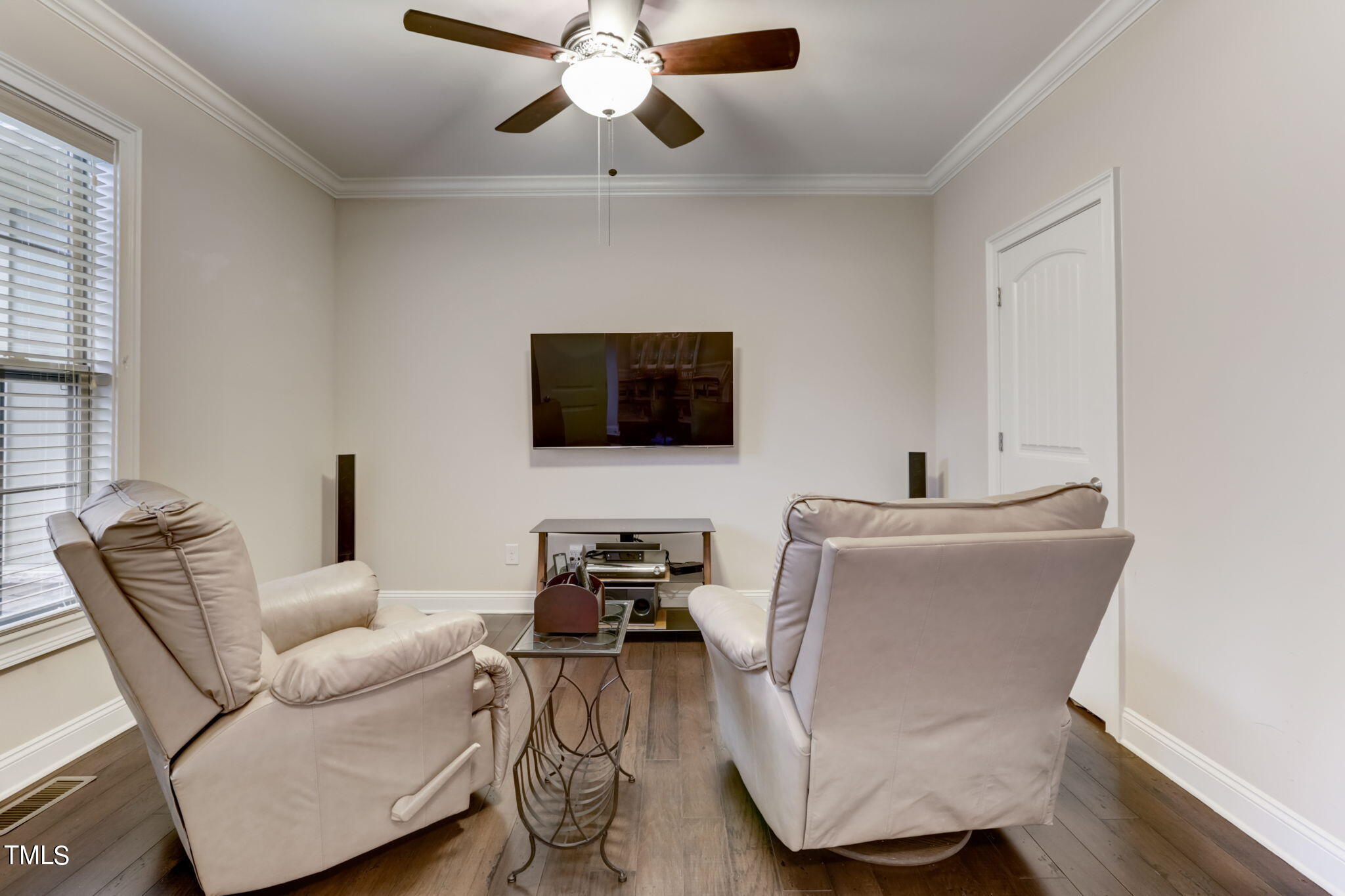 12901 Baybriar Drive Raleigh, NC 27613 - Photo 7 of 41 a living room with furniture and a flat screen tv