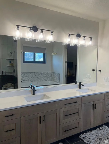 838 East Mountain Road North Ogden, UT 84414 - Photo 19 of 37 Dual vanity featuring a light wood-finish cabinetry, white countertops, and integrated rectangular sinks with matte black fixtures