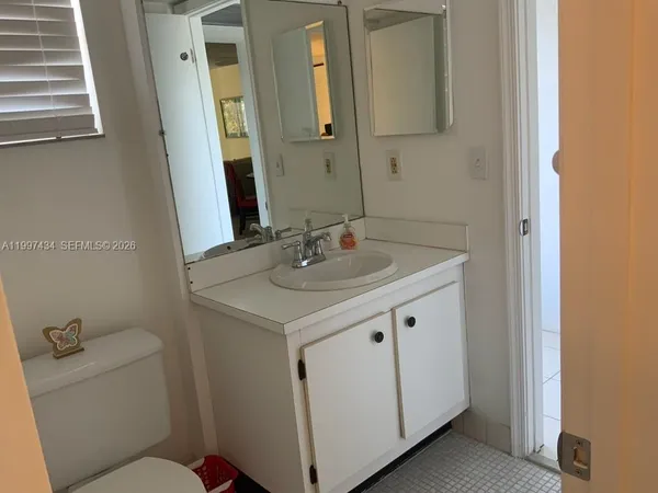 a bathroom with a sink and a toilet