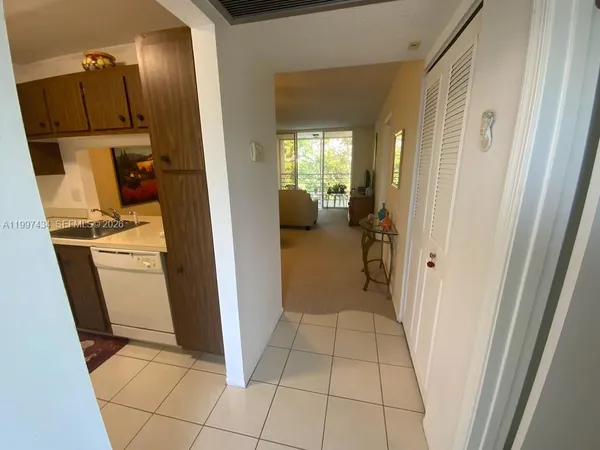 a view of a hallway and closet