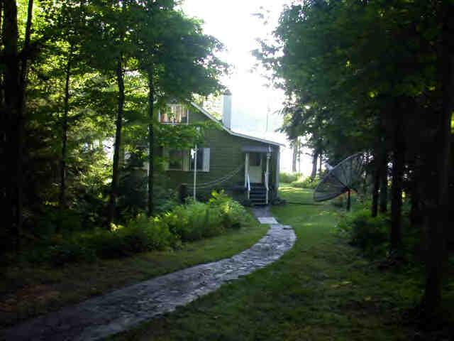 907 Algerie Road Otis, MA 01029 - Photo 7 of 8 a view of a house with backyard and garden
