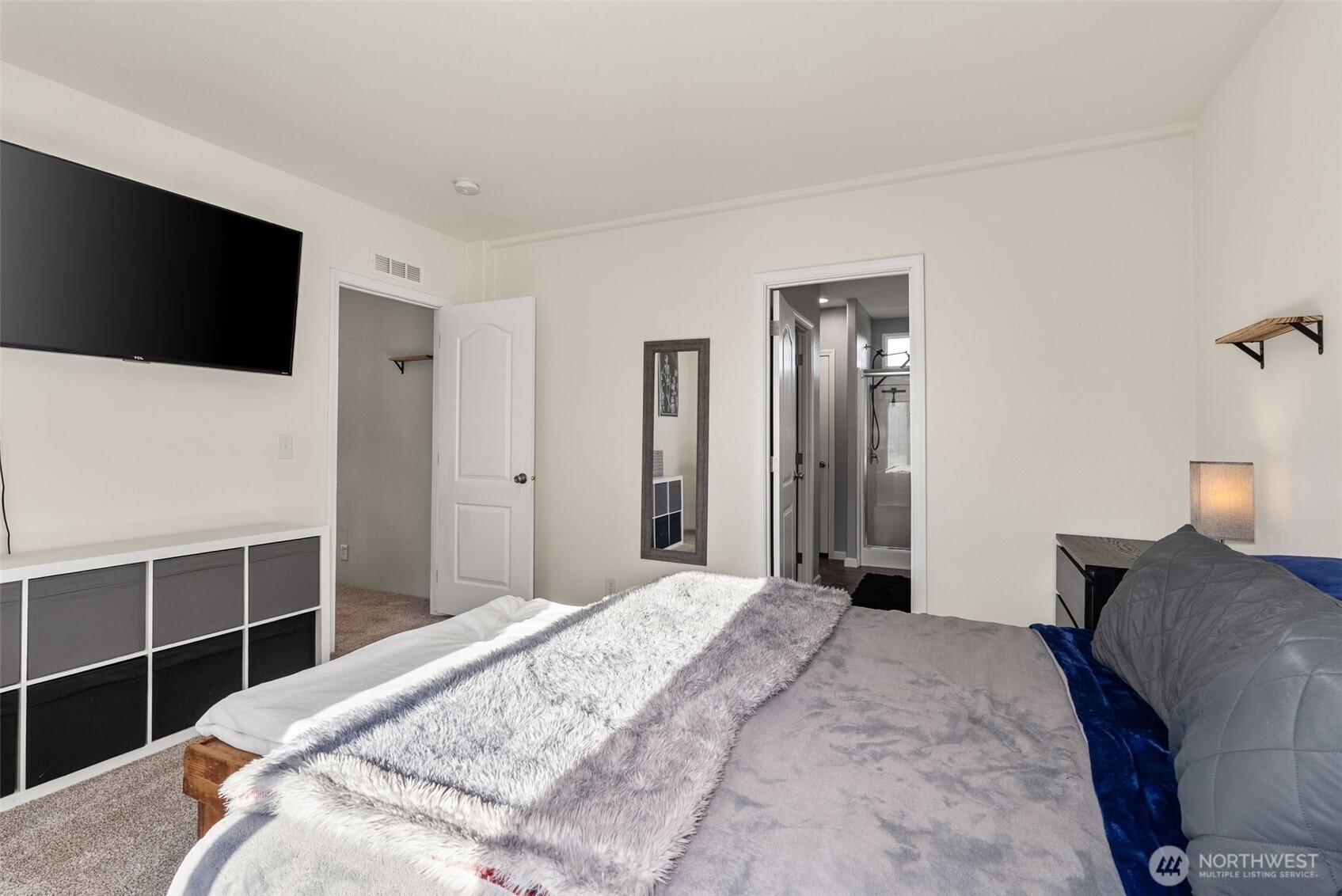 205 Antrim Road Winlock, WA 98596 - Photo 14 of 30 a bedroom with a bed and a flat screen tv