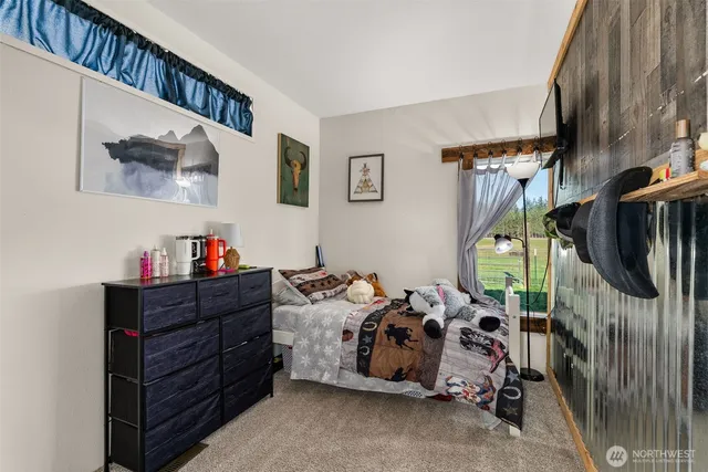 a bed room with a bed and a window