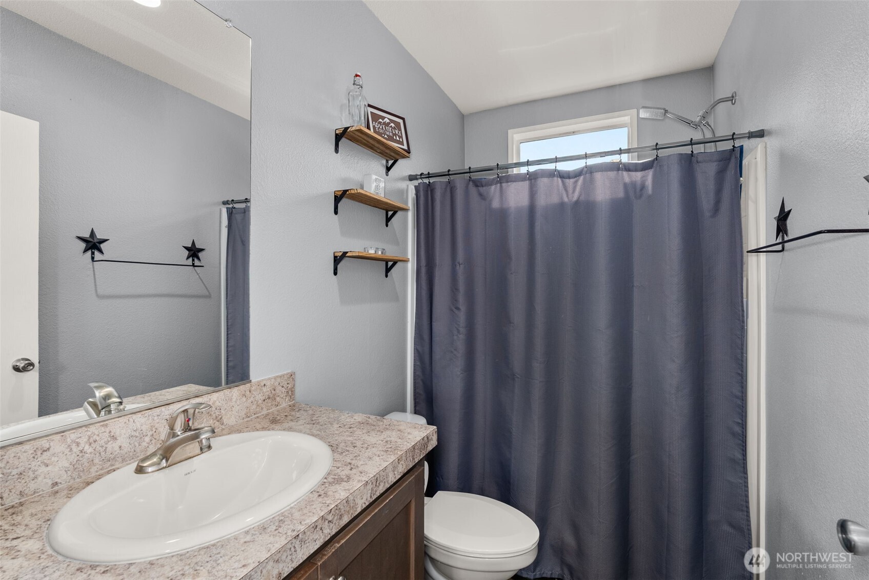 205 Antrim Road Winlock, WA 98596 - Photo 20 of 30 a bathroom with a granite countertop sink toilet and a mirror