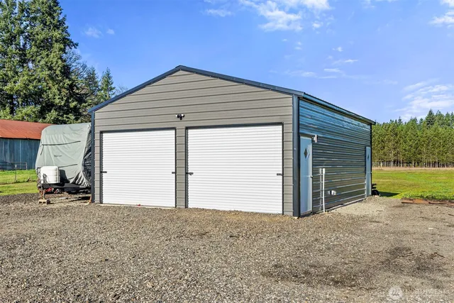 a backyard of house with garage