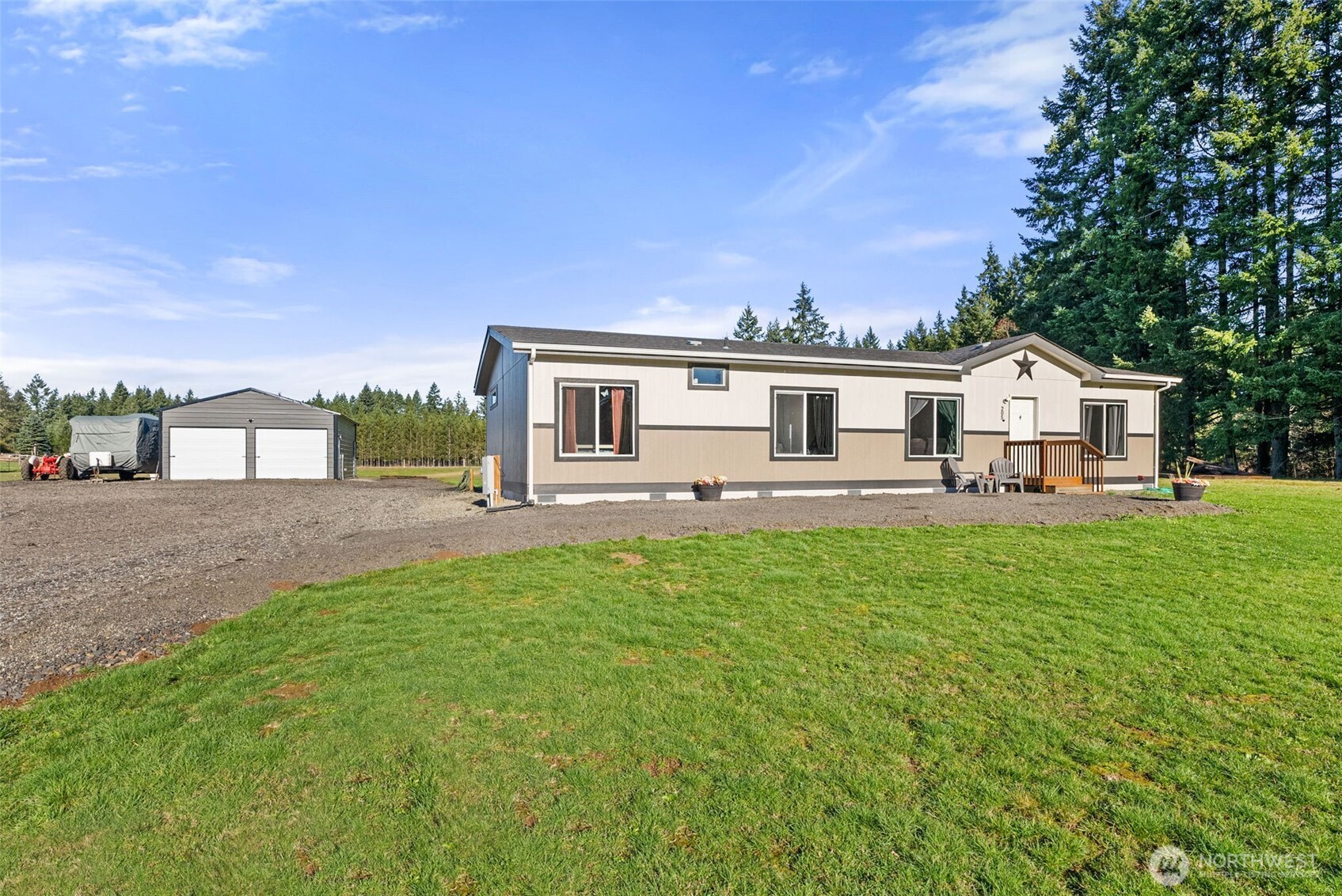 205 Antrim Road Winlock, WA 98596 - Photo 4 of 30 a view of a house with a backyard and a patio