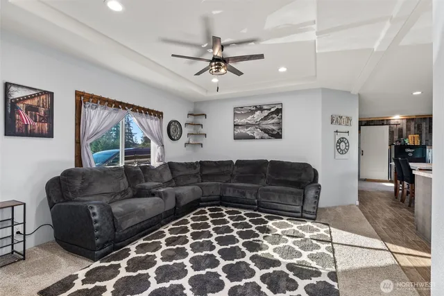 a living room with furniture and a rug