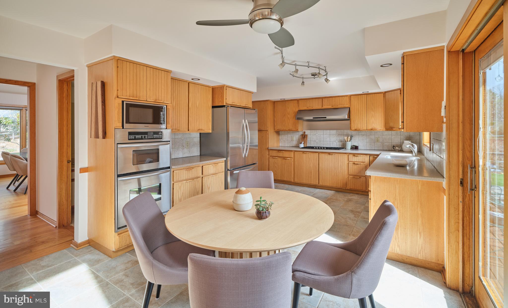 3054 Comfort Road New Hope, PA 18938 - Photo 15 of 64 a dining room with furniture a window and kitchen view