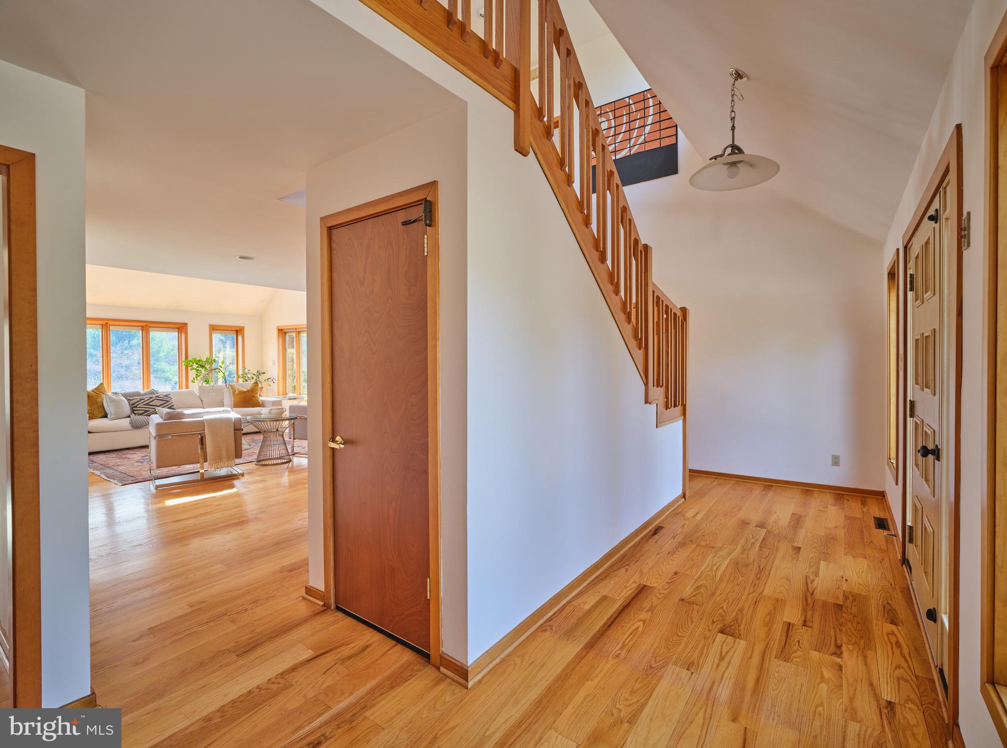 3054 Comfort Road New Hope, PA 18938 - Photo 9 of 64 a view of a living room with wooden floor and stairs