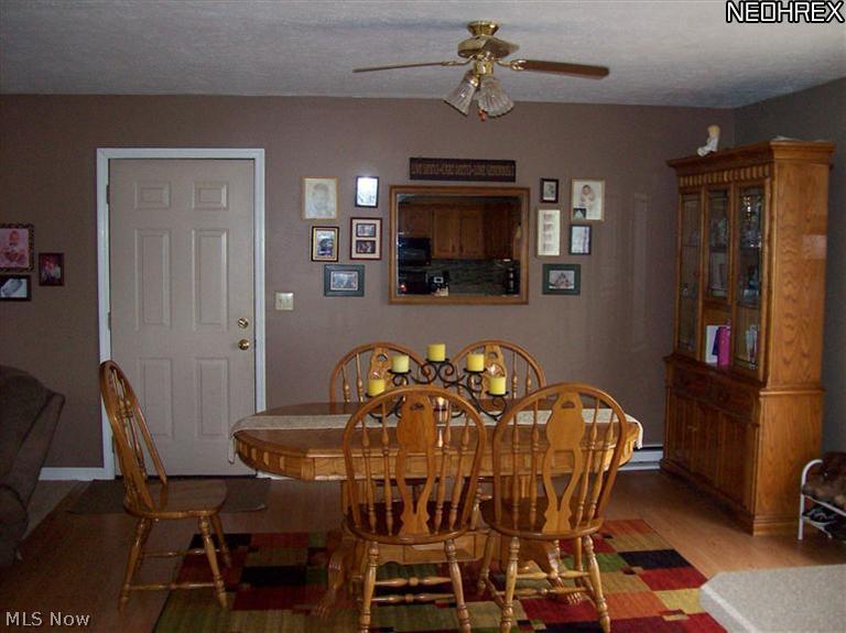 8245 Ruff Road West Salem, OH 44287 - Photo 7 of 25 Another view of the Dining Room. Door to garage will be replaced. Kids measurements on there and seller wants to take.