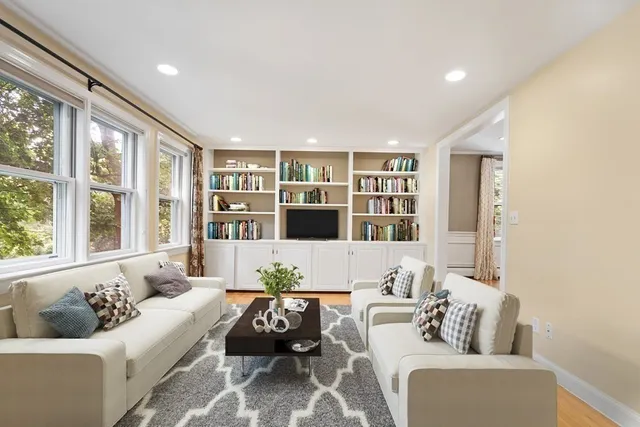 a living room with furniture and a large window