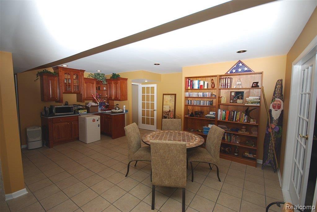 1913 Clover Ridge Drive Howell, MI 48843 - Photo 16 of 24 Bar Table Area Bsmt.jpg