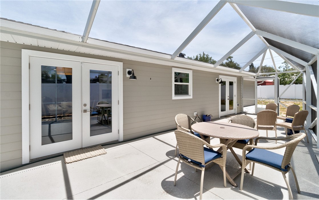 7989 143rd Street Sebastian, FL 32958 - Photo 25 of 30 a patio with table and chairs