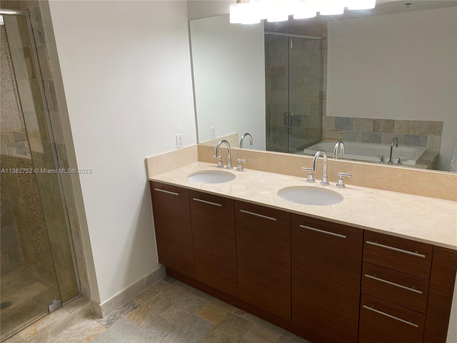 2681 North Flamingo Road, Unit 604S Sunrise, FL 33323 - Photo 14 of 18 a bathroom with a sink and a mirror