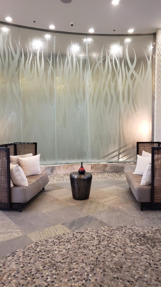 2681 North Flamingo Road, Unit 604S Sunrise, FL 33323 - Photo 6 of 18 a living room with furniture and a couch