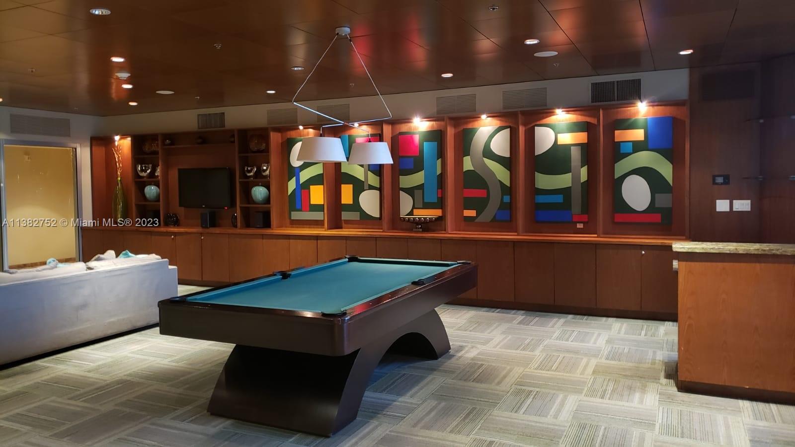 2681 North Flamingo Road, Unit 604S Sunrise, FL 33323 - Photo 8 of 18 a room with pool table and wall paintings