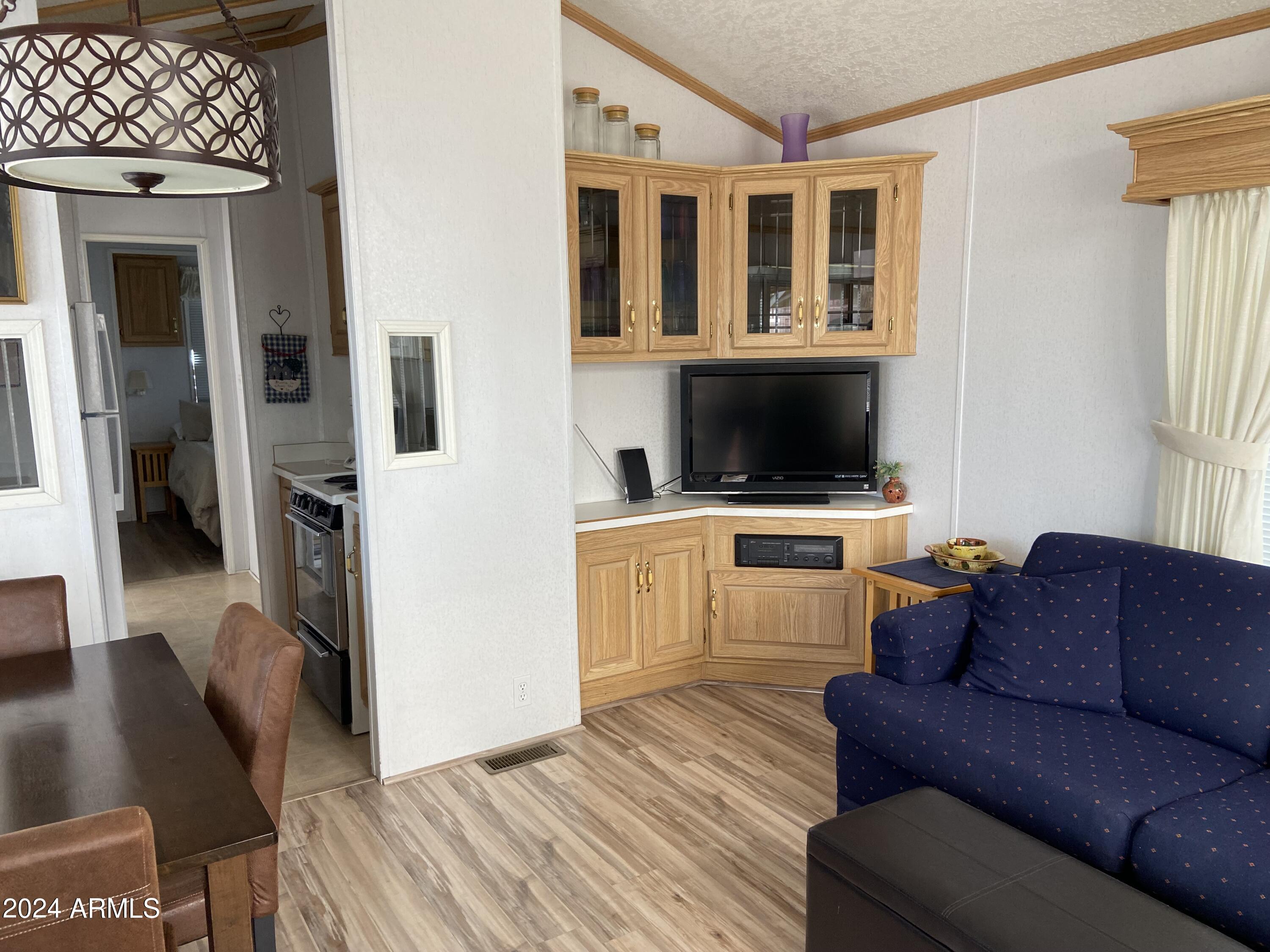 1226 Seneca Drive Apache Junction, AZ 85119 - Photo 12 of 23 a living room with furniture and a flat screen tv