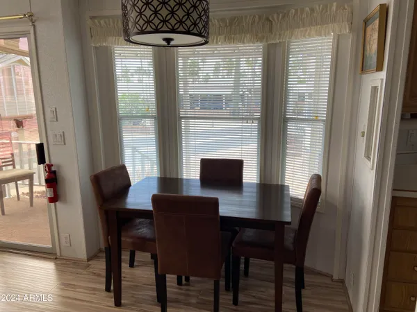 a view of a dining room with furniture and window