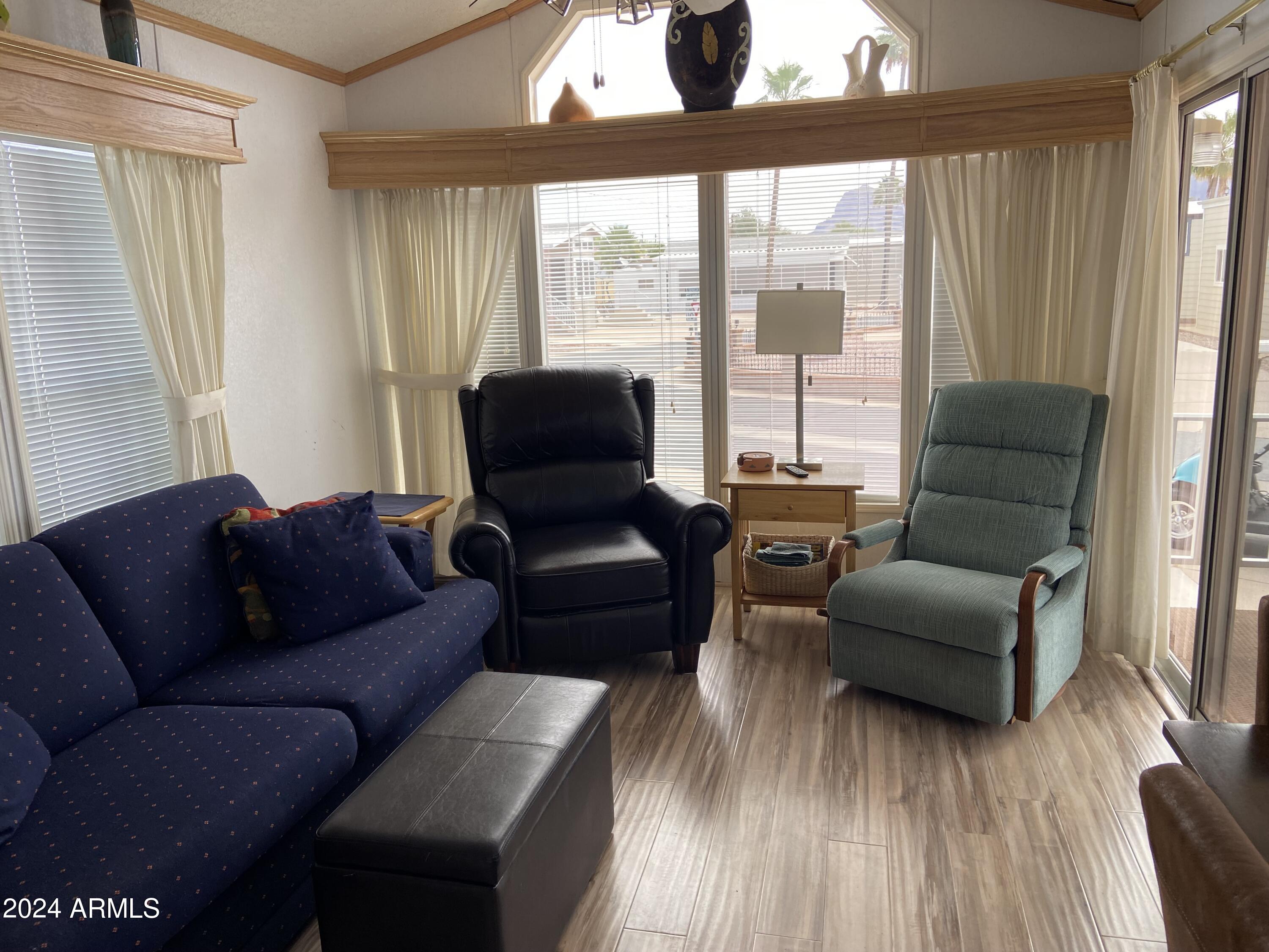 1226 Seneca Drive Apache Junction, AZ 85119 - Photo 15 of 23 a living room with furniture and a window