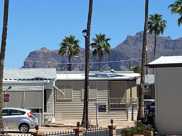a view of a house with a cars park