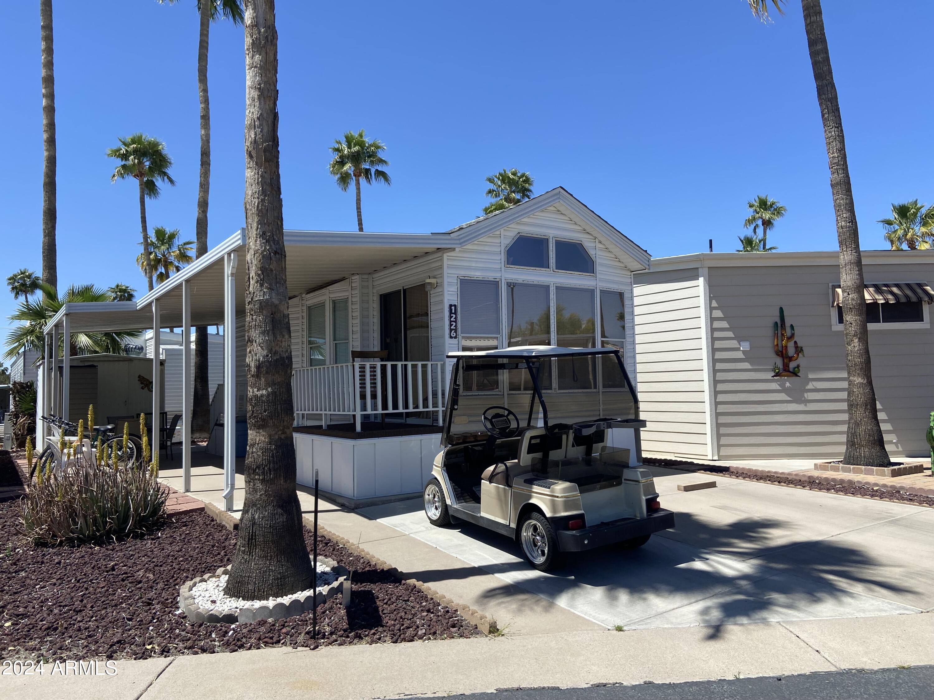 1226 Seneca Drive Apache Junction, AZ 85119 - Photo 23 of 23 a front view of a house with a porch