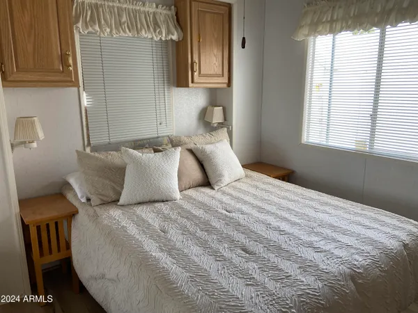 a bedroom with a bed and window
