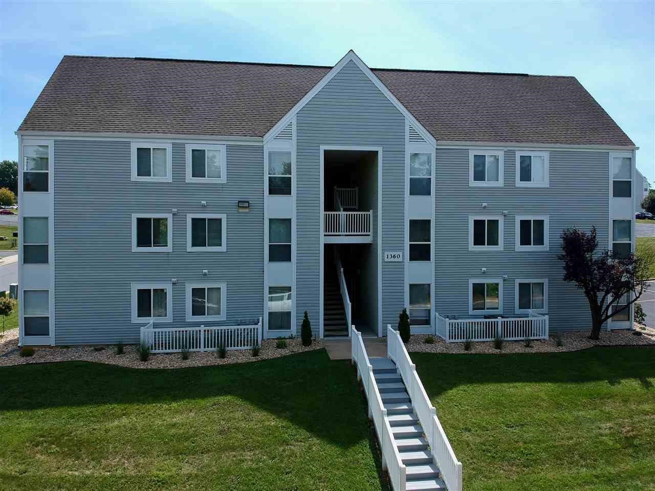 1360 Hunters Road, Unit A Harrisonburg, VA 22801 - Photo 1 of 13 a front view of a house with a yard