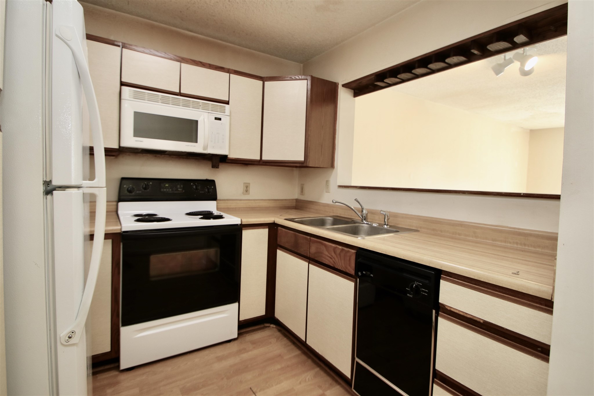 1360 Hunters Road, Unit A Harrisonburg, VA 22801 - Photo 3 of 13 a kitchen with stainless steel appliances granite countertop a sink and a microwave