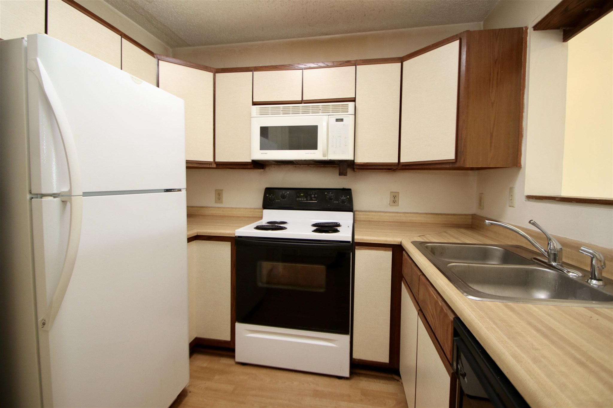 1360 Hunters Road, Unit A Harrisonburg, VA 22801 - Photo 4 of 13 a kitchen with a refrigerator sink and microwave