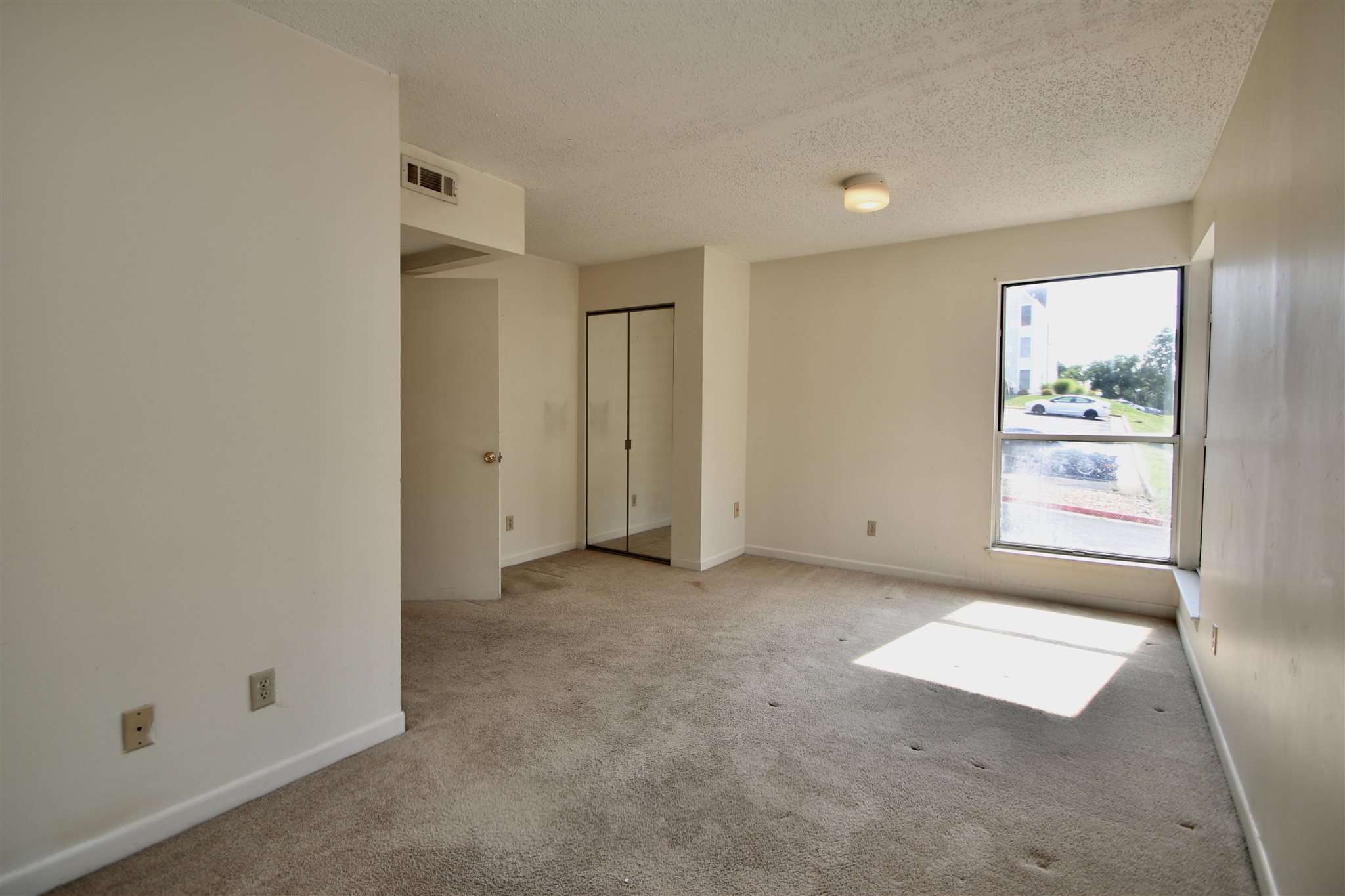 1360 Hunters Road, Unit A Harrisonburg, VA 22801 - Photo 8 of 13 an empty room with windows