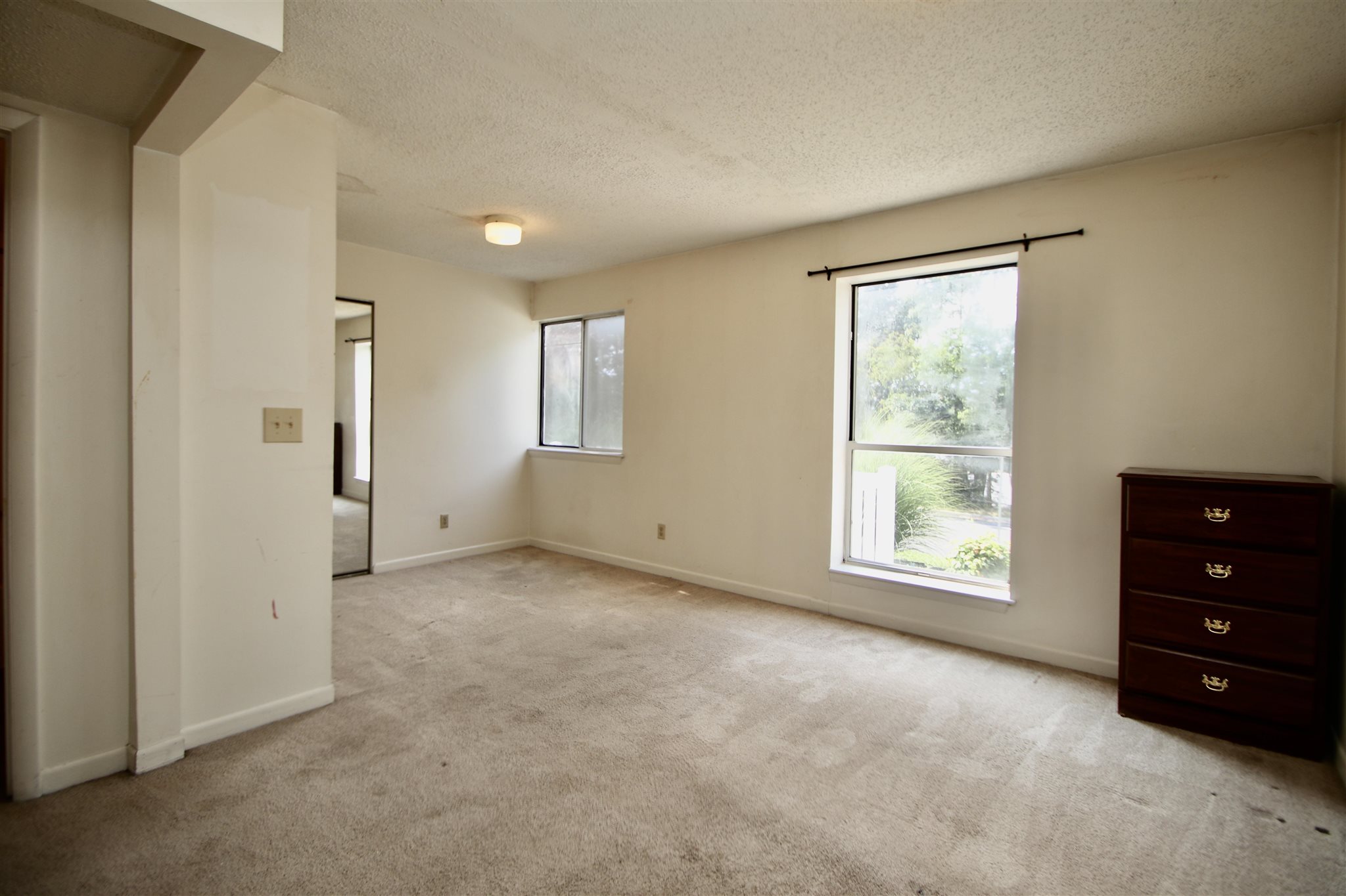 1360 Hunters Road, Unit A Harrisonburg, VA 22801 - Photo 9 of 13 an empty room with windows and closet
