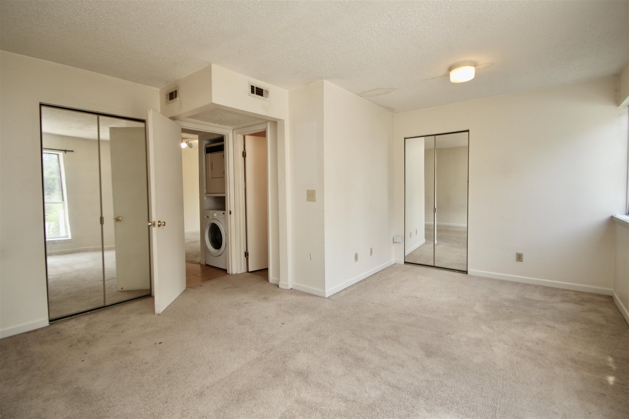 1360 Hunters Road, Unit A Harrisonburg, VA 22801 - Photo 10 of 13 an empty room with closet and windows