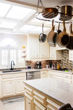 a kitchen with a stove cabinets and white appliances