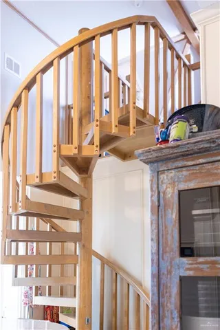 a view of hall with wooden floor and dining room