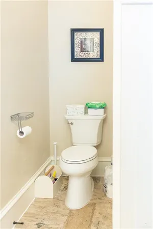 a white toilet sitting next to a white sink