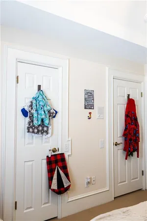 a vase of flowers sitting on a floor in a room