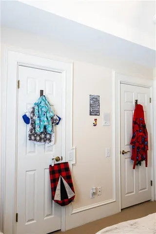 a vase of flowers sitting on a floor in a room