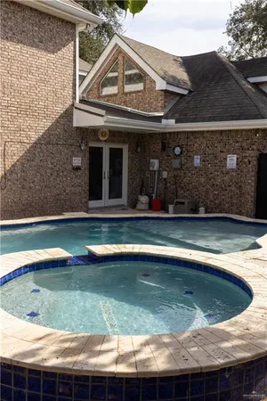 a view of a house with swimming pool