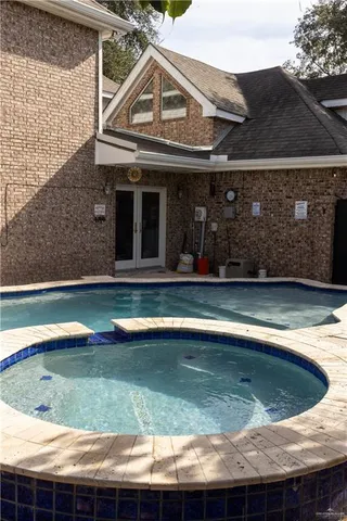 a view of a house with swimming pool