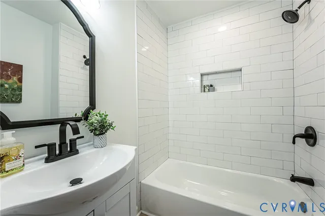 a bathroom with a bathtub and shower