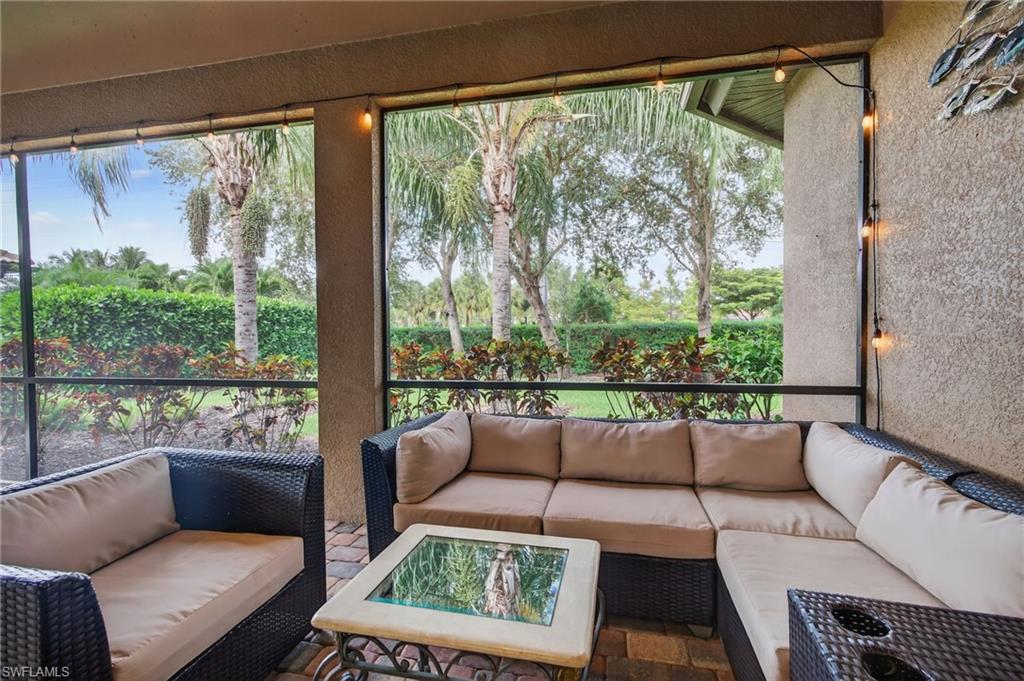 7235 Acorn Way Naples, FL 34119 - Photo 31 of 40 a living room with furniture and a window