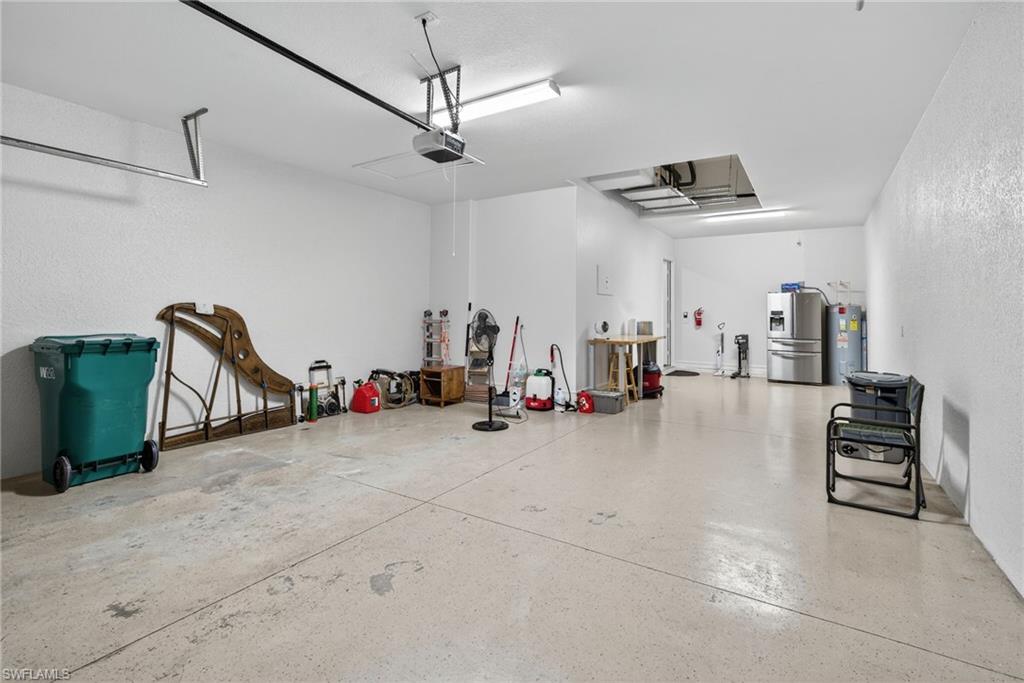 7235 Acorn Way Naples, FL 34119 - Photo 36 of 40 a view of a livingroom with gym equipment