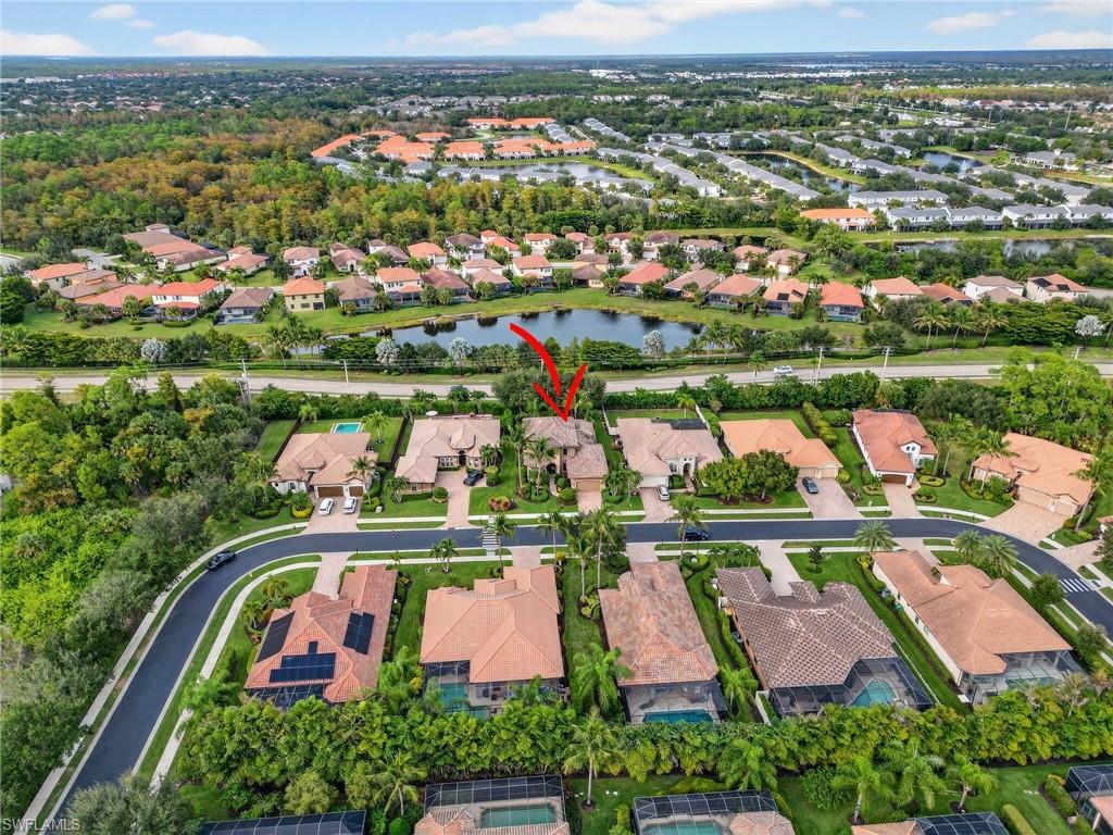 7235 Acorn Way Naples, FL 34119 - Photo 37 of 40 an aerial view of swimming pool outdoor seating and yard