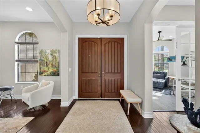 a view of a livingroom with furniture wooden floor and a rug