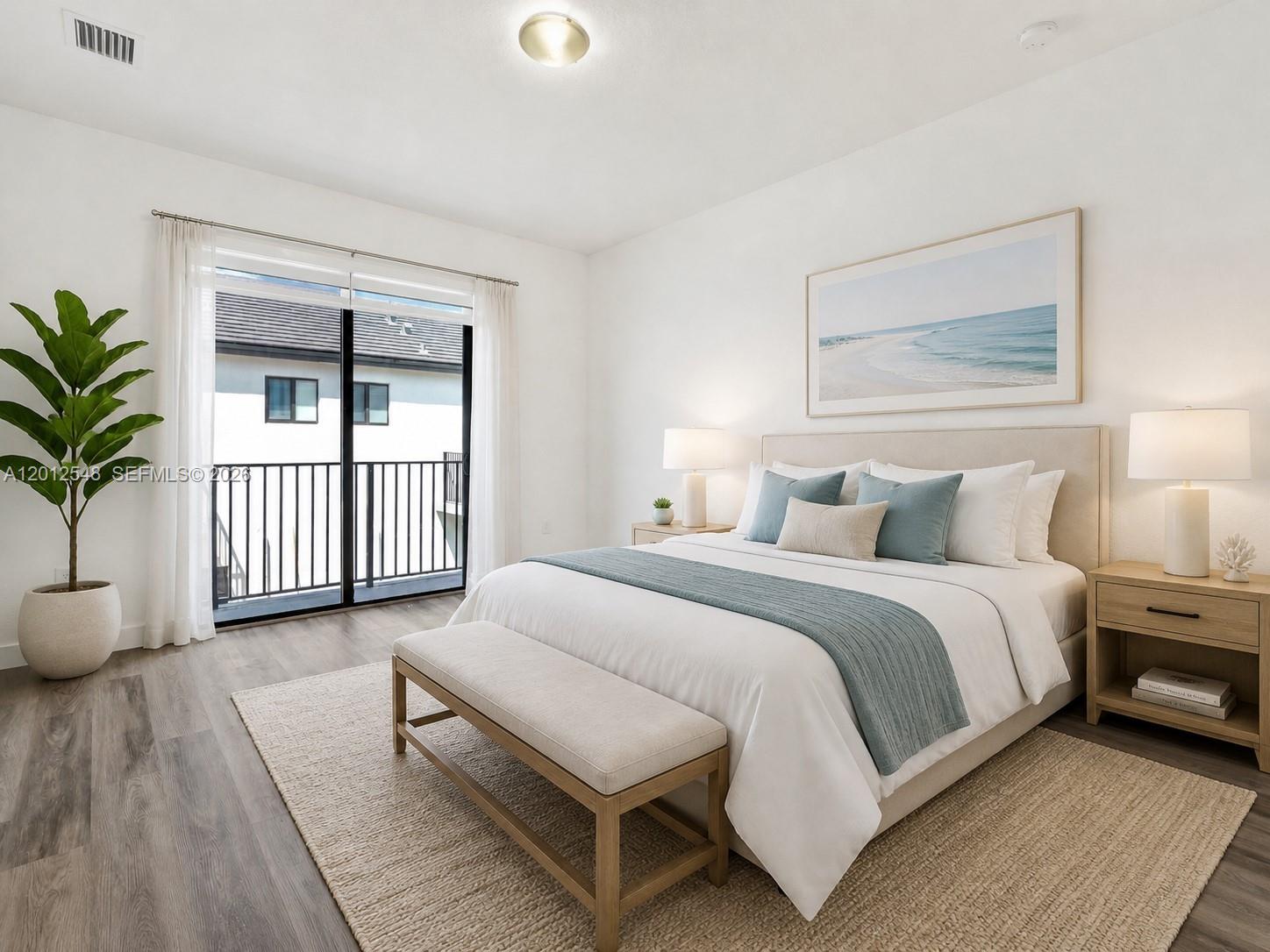 13642 Southwest 157th Place, Unit 13642 Miami, FL 33196 - Photo 18 of 41 a spacious bedroom with a large bed and a window