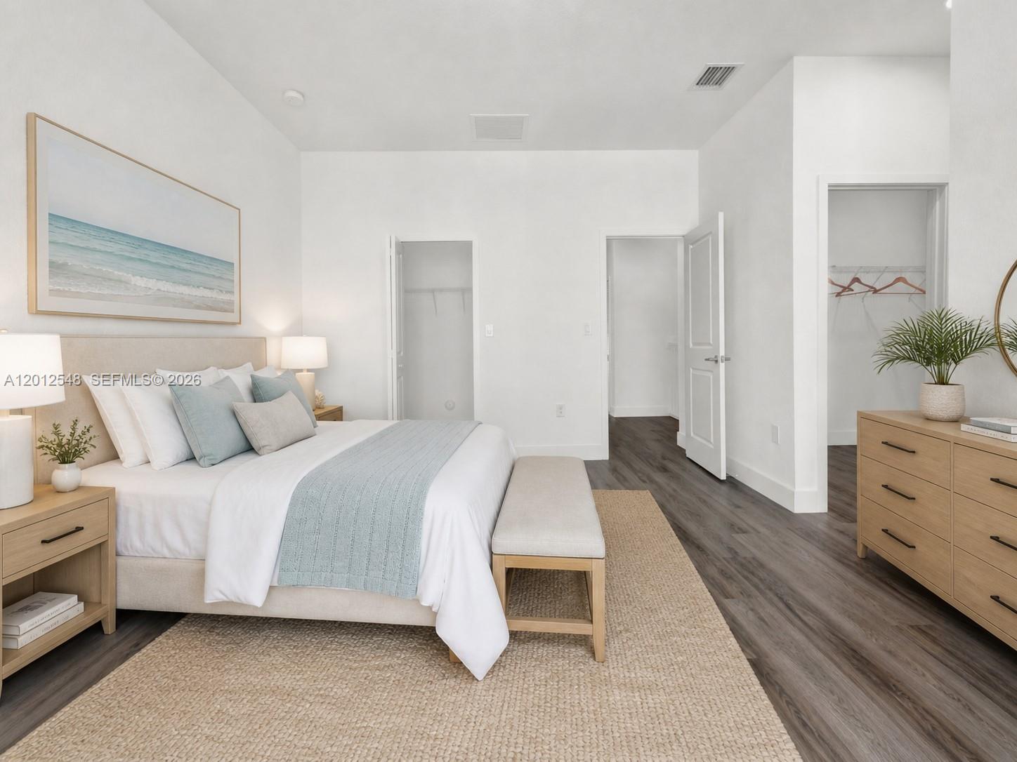 13642 Southwest 157th Place, Unit 13642 Miami, FL 33196 - Photo 20 of 41 a spacious bedroom with a bed and a dresser