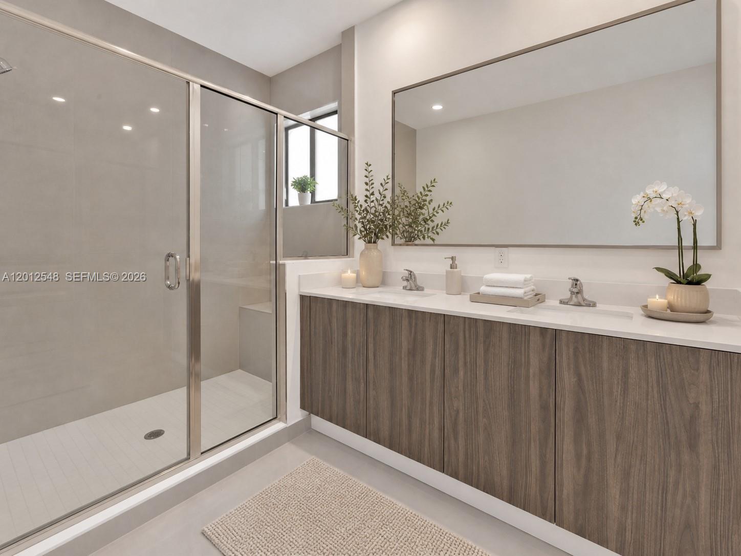 13642 Southwest 157th Place, Unit 13642 Miami, FL 33196 - Photo 25 of 41 a bathroom with a shower sink and mirror
